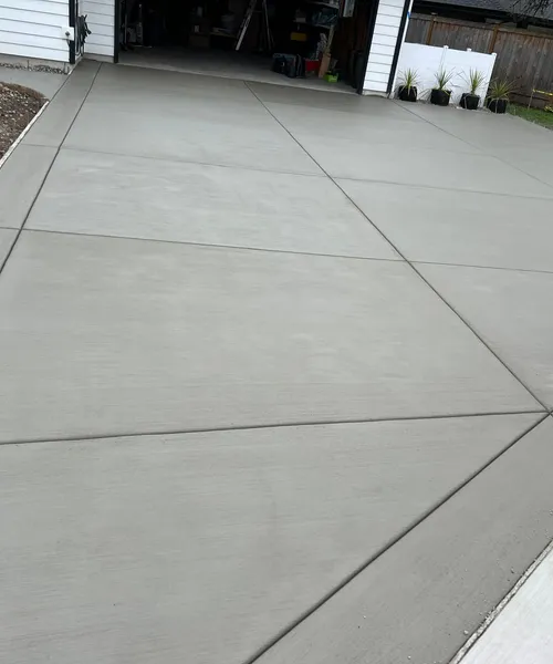 Broom Finish Driveway Replacement With Decorative Borders in Newcastle 